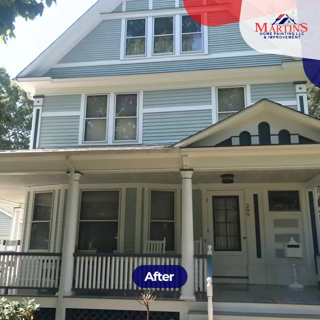 After exterior house painting: fresh light blue siding and crisp white trim.
