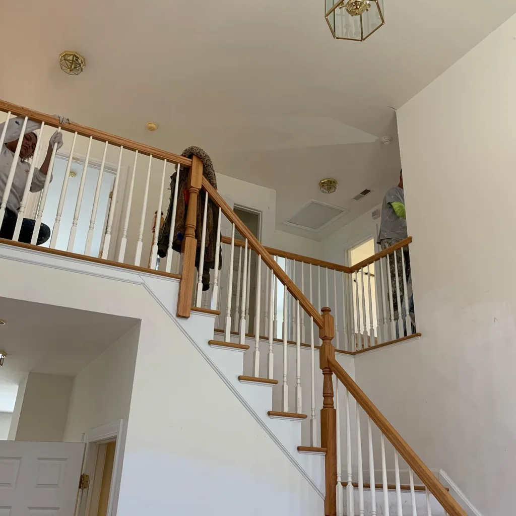 Interior home renovation: Staircase area with painting preparation