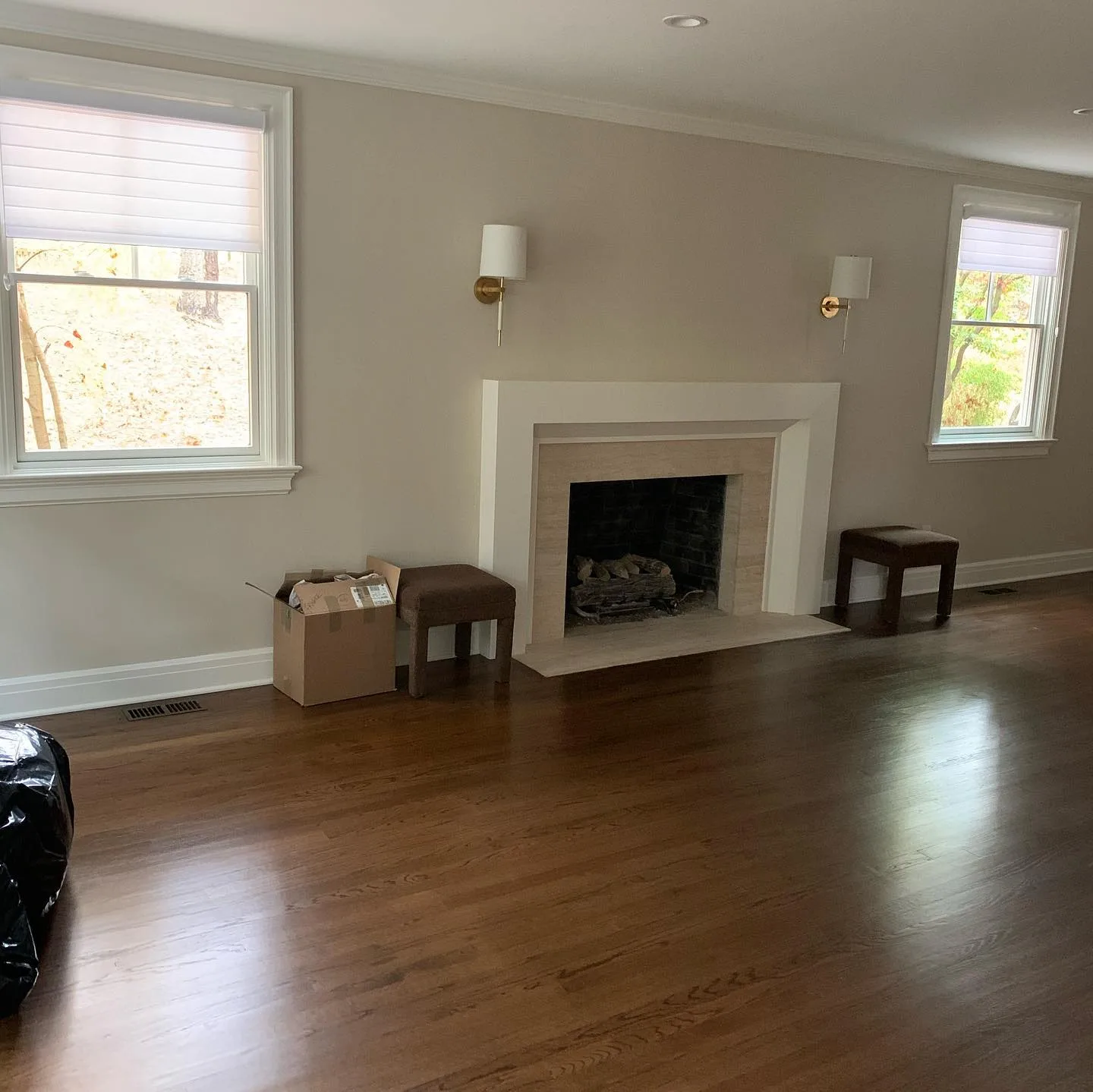 Fully restored room with fireplace highlighting interior house painting quality.